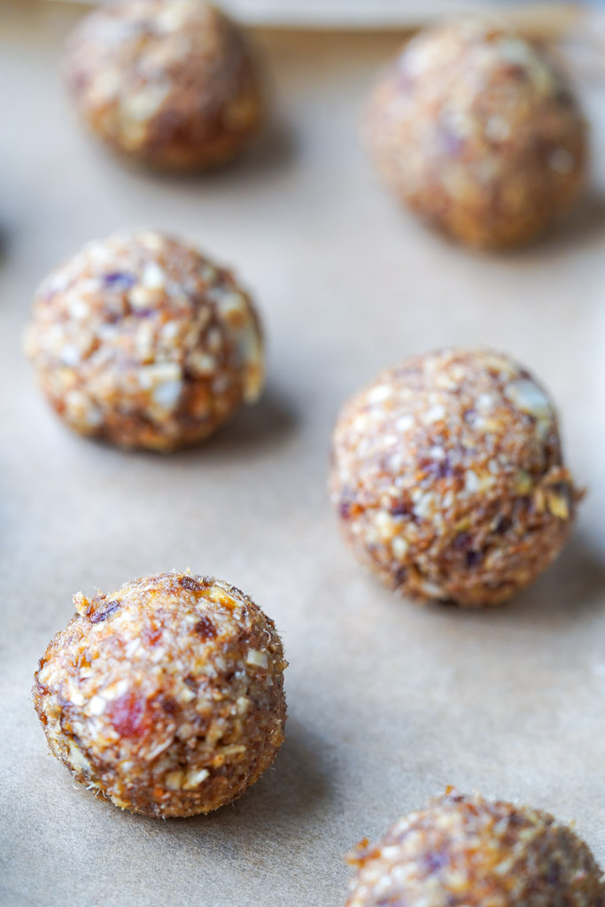 uncoated date balls on parchment paper