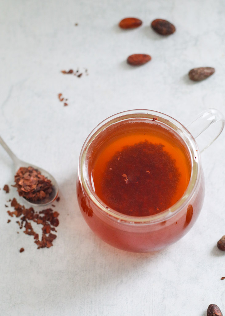 cacao nibs steeped in hot water to create tea