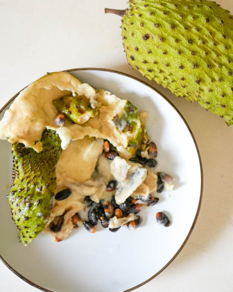 seeds separated from soursop flesh on a plate